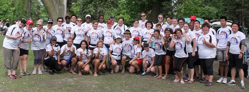 Group photo of the over 40 members of the two Pride teams, sporing their medals from the day of racing at the 130th annual DDRA Canada Day Regatta at Centre Island.