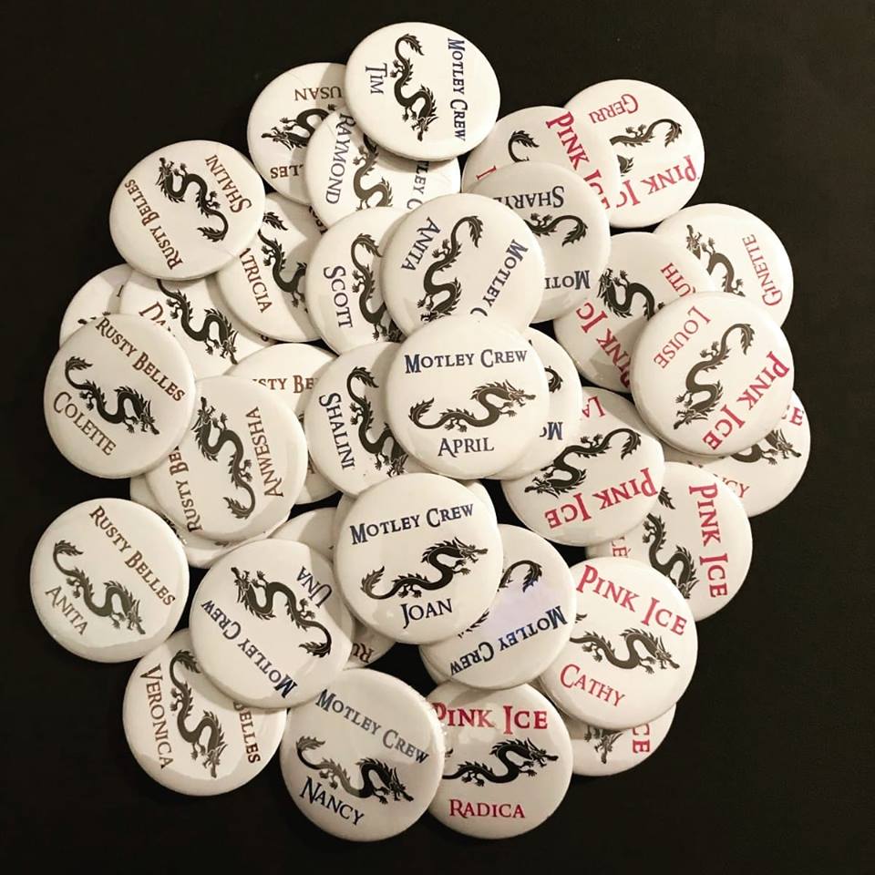 Photo of pin-on buttons created by Louise Granahan with team name and first name for each paddler.