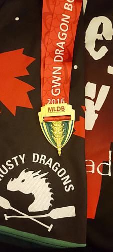 Picture of our 200m gold medal from the 2016 GWN Dragon Boat Challenge, shown on a Motlet Crew jersey as the background.
